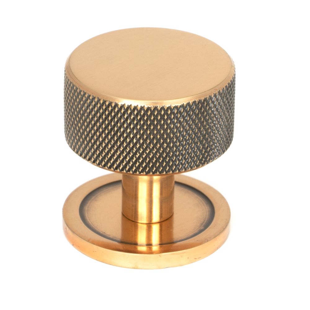 This is an image showing From The Anvil - Polished Bronze Brompton Cabinet Knob - 32mm (Plain) available from T.H Wiggans Architectural Ironmongery in Kendal, quick delivery and discounted prices