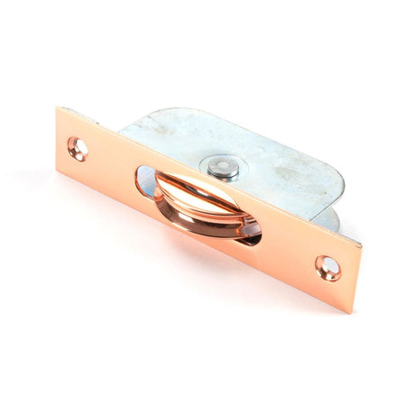 This is an image showing From The Anvil - Polished Bronze Square Ended Sash Pulley 75kg available from T.H Wiggans Architectural Ironmongery in Kendal, quick delivery and discounted prices