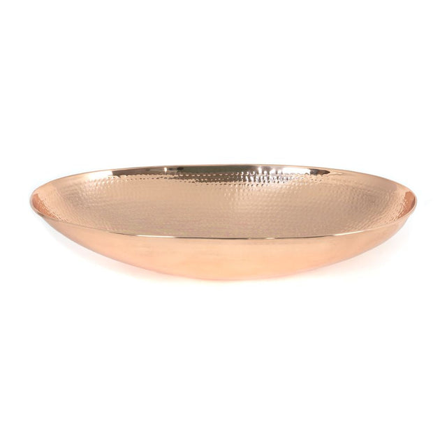 This is an image showing From The Anvil - Hammered Copper Oval Sink available from T.H Wiggans Architectural Ironmongery in Kendal, quick delivery and discounted prices