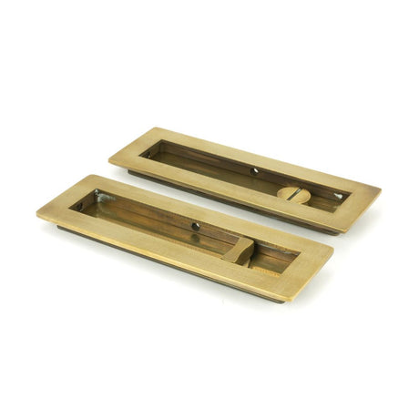 This is an image of From The Anvil - Aged Brass 175mm Plain Rectangular Pull - Privacy Set available to order from T.H Wiggans Architectural Ironmongery in Kendal, quick delivery and discounted prices.