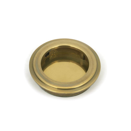 This is an image of From The Anvil - Aged Brass 60mm Art Deco Round Pull available to order from T.H Wiggans Architectural Ironmongery in Kendal, quick delivery and discounted prices.
