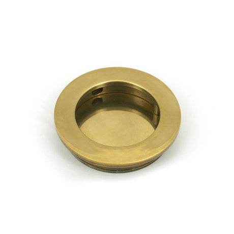 This is an image of From The Anvil - Aged Brass 60mm Plain Round Pull available to order from T.H Wiggans Architectural Ironmongery in Kendal, quick delivery and discounted prices.