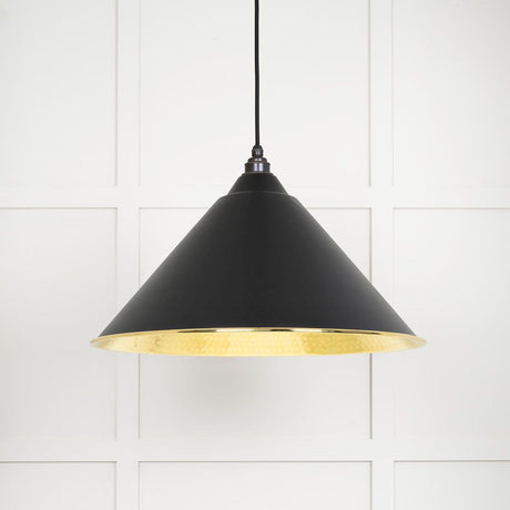 This is an image showing From The Anvil - Hammered Brass Hockley Pendant in Elan Black available from T.H Wiggans Architectural Ironmongery in Kendal, quick delivery and discounted prices
