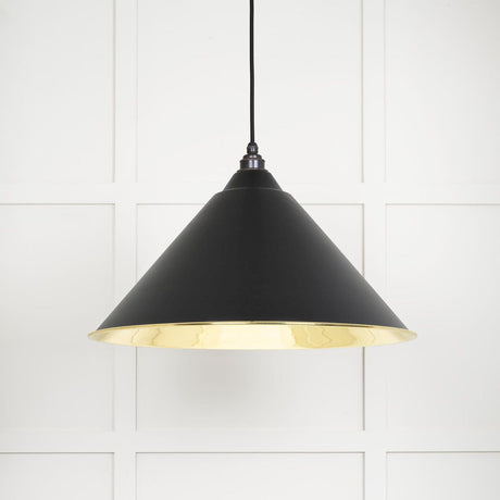 This is an image showing From The Anvil - Smooth Brass Hockley Pendant in Elan Black available from T.H Wiggans Architectural Ironmongery in Kendal, quick delivery and discounted prices