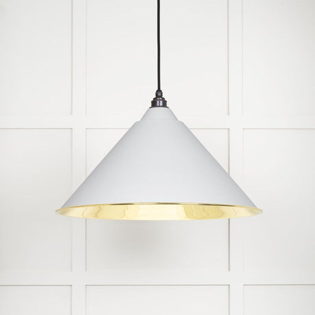 This is an image showing From The Anvil - Smooth Brass Hockley Pendant in Flock available from T.H Wiggans Architectural Ironmongery in Kendal, quick delivery and discounted prices