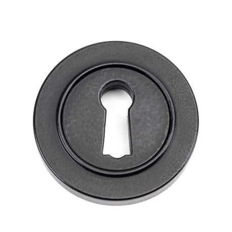 This is an image of From The Anvil - Matt Black Round Escutcheon (Plain) available to order from T.H Wiggans Architectural Ironmongery in Kendal, quick delivery and discounted prices.