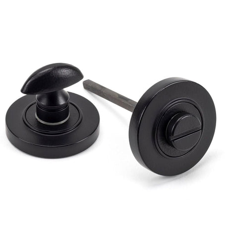This is an image of From The Anvil - Matt Black Round Thumbturn Set (Plain) available to order from T.H Wiggans Architectural Ironmongery in Kendal, quick delivery and discounted prices.