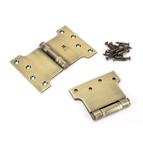 This is an image showing From The Anvil - Aged Brass 4" x 4" x 6" Parliament Hinge (pair) ss available from T.H Wiggans Architectural Ironmongery, quick delivery and discounted prices