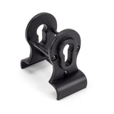 This is an image showing From The Anvil - Matt Black 50mm Euro Door Pull (Back to Back fixing) available from trade door handles, quick delivery and discounted prices