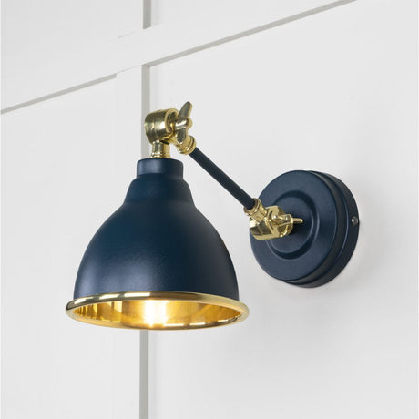 This is an image showing From The Anvil - Smooth Brass Brindley Wall Light in Dusk available from T.H Wiggans Architectural Ironmongery in Kendal, quick delivery and discounted prices