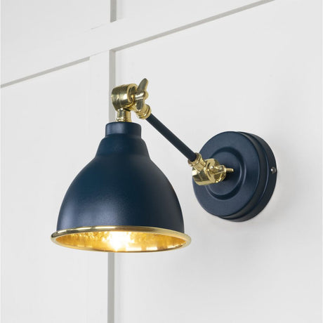 This is an image showing From The Anvil - Hammered Brass Brindley Wall Light in Dusk available from T.H Wiggans Architectural Ironmongery in Kendal, quick delivery and discounted prices