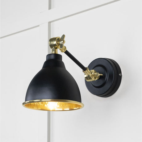 This is an image showing From The Anvil - Hammered Brass Brindley Wall Light in Elan Black available from T.H Wiggans Architectural Ironmongery in Kendal, quick delivery and discounted prices