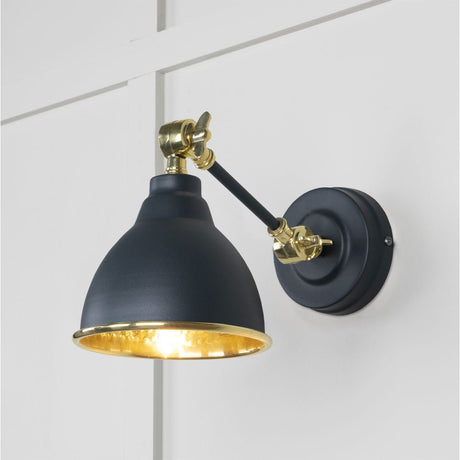 This is an image showing From The Anvil - Hammered Brass Brindley Wall Light in Soot available from T.H Wiggans Architectural Ironmongery in Kendal, quick delivery and discounted prices