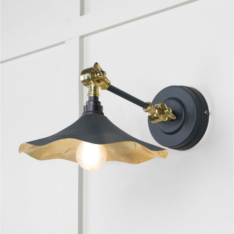 This is an image showing From The Anvil - Smooth Brass Flora Wall Light in Soot available from T.H Wiggans Architectural Ironmongery in Kendal, quick delivery and discounted prices
