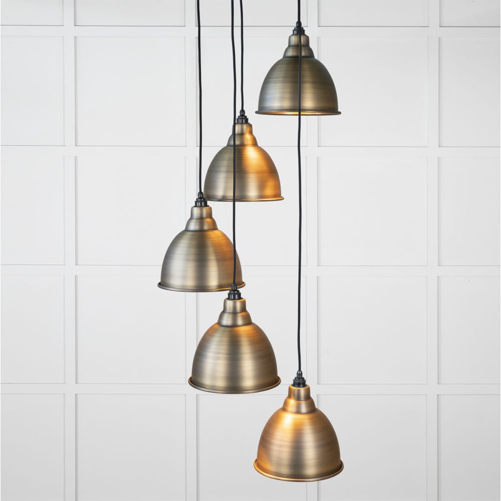 This is an image showing From The Anvil - Aged Brass Brindley Cluster Pendant available from T.H Wiggans Architectural Ironmongery in Kendal, quick delivery and discounted prices