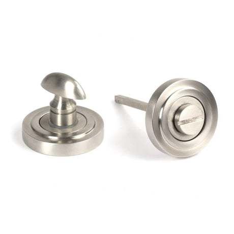 This is an image of From The Anvil - Satin Marine SS (316) Round Thumbturn Set (Art Deco) available to order from T.H Wiggans Architectural Ironmongery in Kendal, quick delivery and discounted prices.