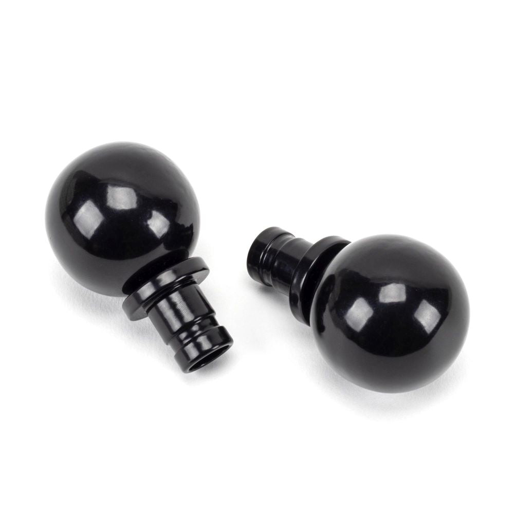 This is an image showing From The Anvil - Black Ball Curtain Finial (pair) available from trade door handles, quick delivery and discounted prices