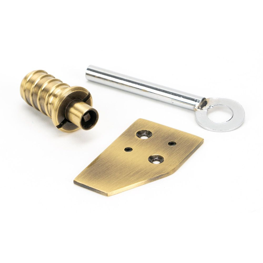 This is an image showing From The Anvil - Aged Brass Key-Flush Sash Stop available from T.H Wiggans Architectural Ironmongery in Kendal, quick delivery and discounted prices
