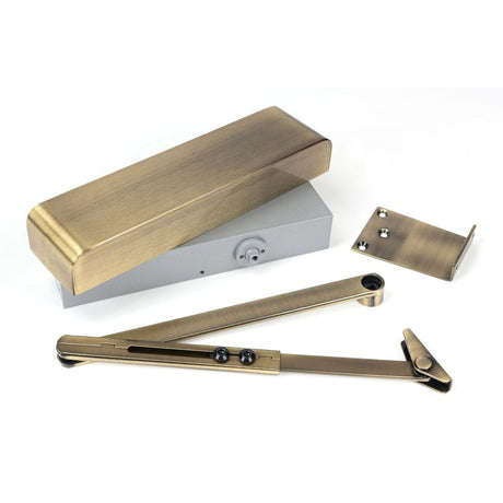 This is an image of From The Anvil - Aged Brass Size 2-5 Door Closer & Cover available to order from T.H Wiggans Architectural Ironmongery in Kendal, quick delivery and discounted prices.