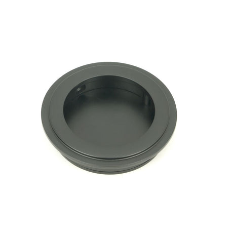 This is an image of From The Anvil - Matt Black 60mm Art Deco Round Pull available to order from T.H Wiggans Architectural Ironmongery in Kendal, quick delivery and discounted prices.