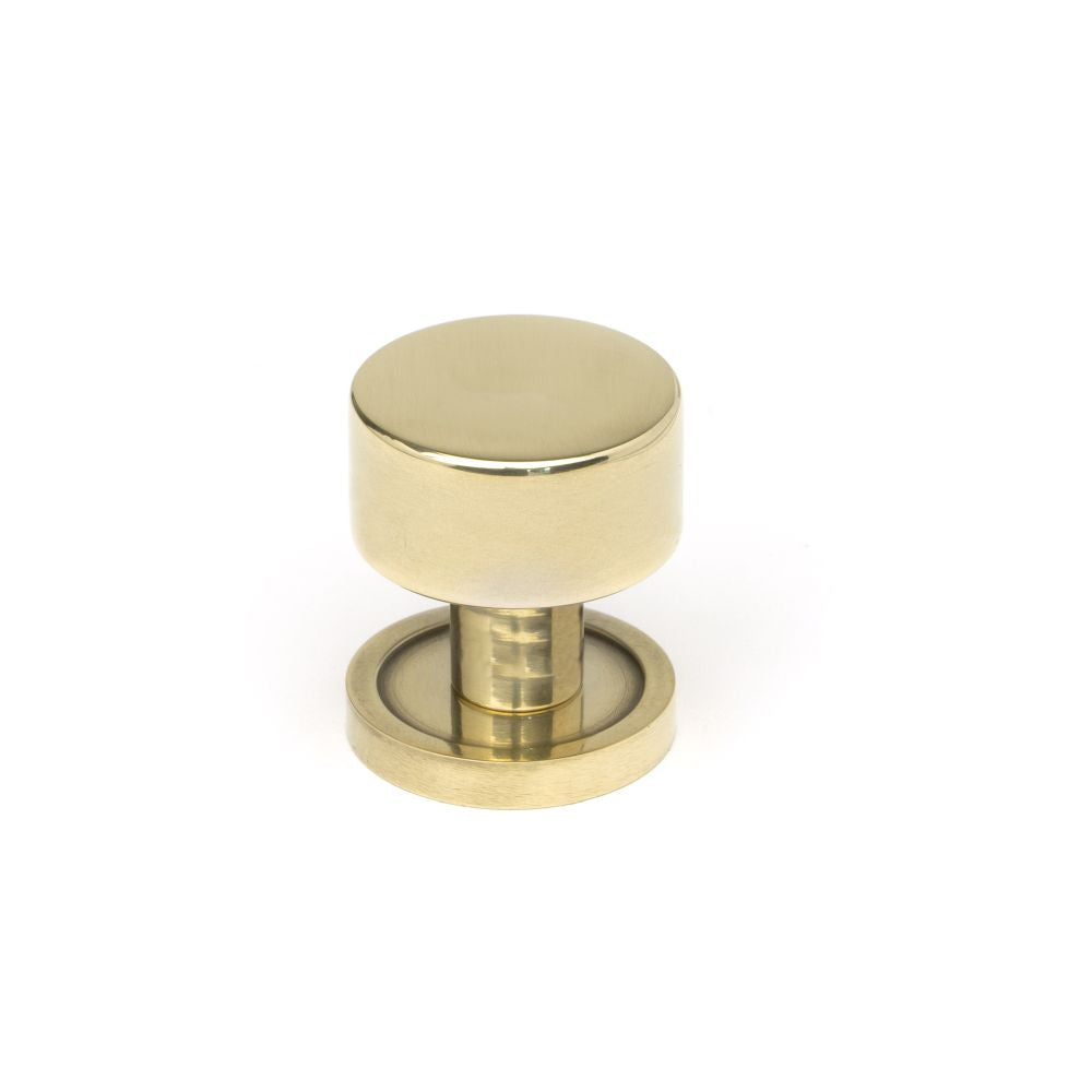 This is an image showing From The Anvil - Aged Brass Kelso Cabinet Knob - 25mm (Plain) available from T.H Wiggans Architectural Ironmongery in Kendal, quick delivery and discounted prices
