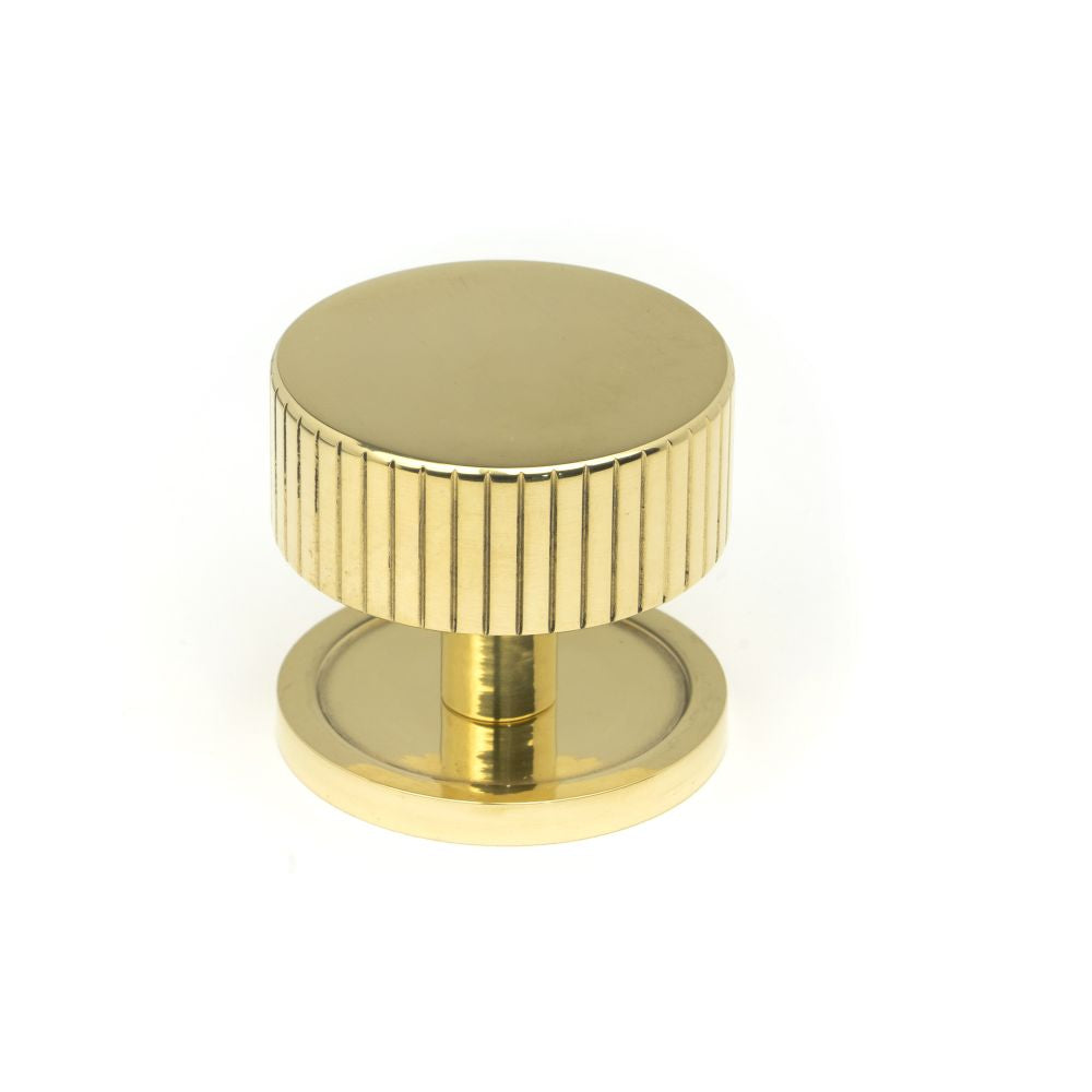 This is an image showing From The Anvil - Polished Brass Judd Cabinet Knob - 38mm (Plain) available from T.H Wiggans Architectural Ironmongery in Kendal, quick delivery and discounted prices