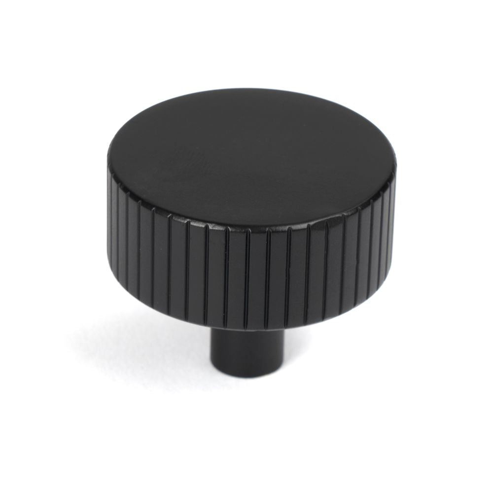 This is an image showing From The Anvil - Matt Black Judd Cabinet Knob - 38mm (No rose) available from T.H Wiggans Architectural Ironmongery in Kendal, quick delivery and discounted prices