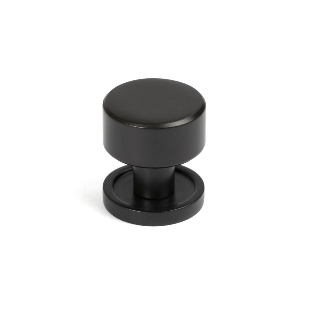 This is an image showing From The Anvil - Aged Bronze Kelso Cabinet Knob - 25mm (Plain) available from T.H Wiggans Architectural Ironmongery in Kendal, quick delivery and discounted prices