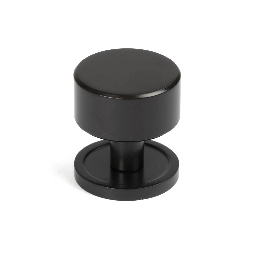 This is an image showing From The Anvil - Aged Bronze Kelso Cabinet Knob - 32mm (Plain) available from T.H Wiggans Architectural Ironmongery in Kendal, quick delivery and discounted prices