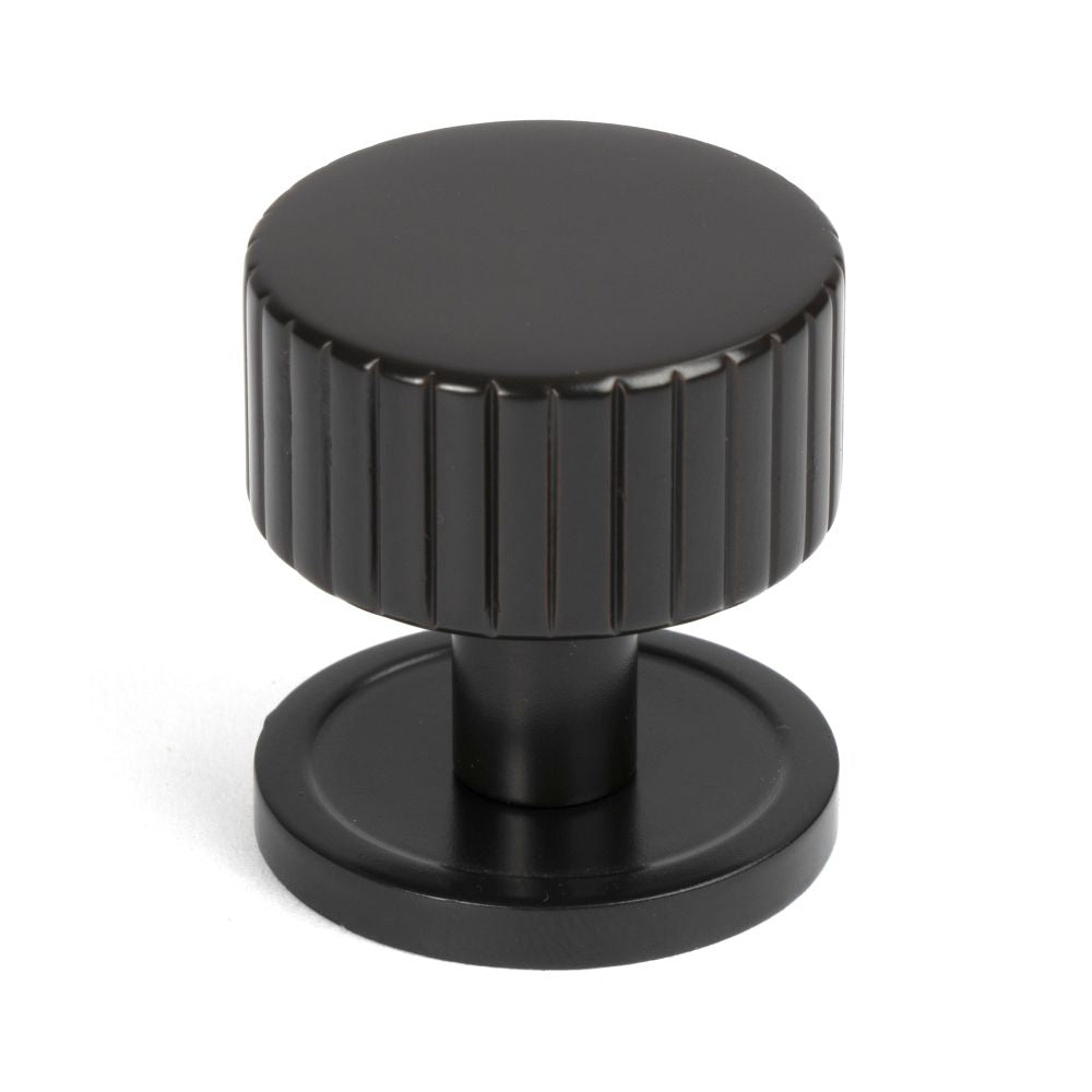This is an image showing From The Anvil - Aged Bronze Judd Cabinet Knob - 32mm (Plain) available from T.H Wiggans Architectural Ironmongery in Kendal, quick delivery and discounted prices