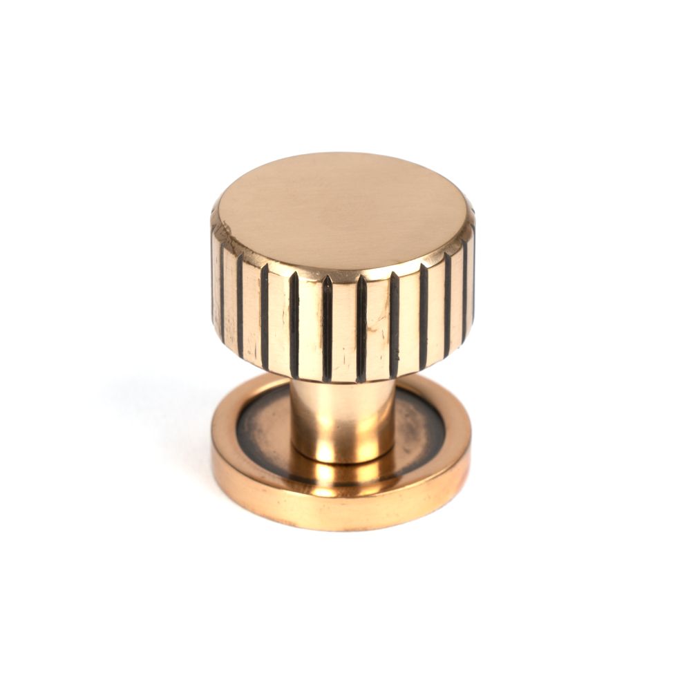 This is an image showing From The Anvil - Polished Bronze Judd Cabinet Knob - 25mm (Plain) available from T.H Wiggans Architectural Ironmongery in Kendal, quick delivery and discounted prices