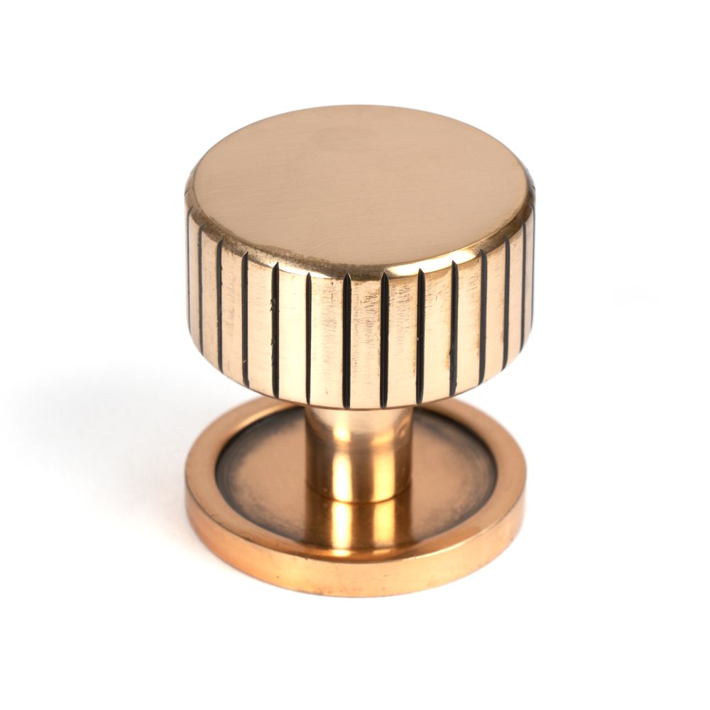 This is an image showing From The Anvil - Polished Bronze Judd Cabinet Knob - 32mm (Plain) available from T.H Wiggans Architectural Ironmongery in Kendal, quick delivery and discounted prices