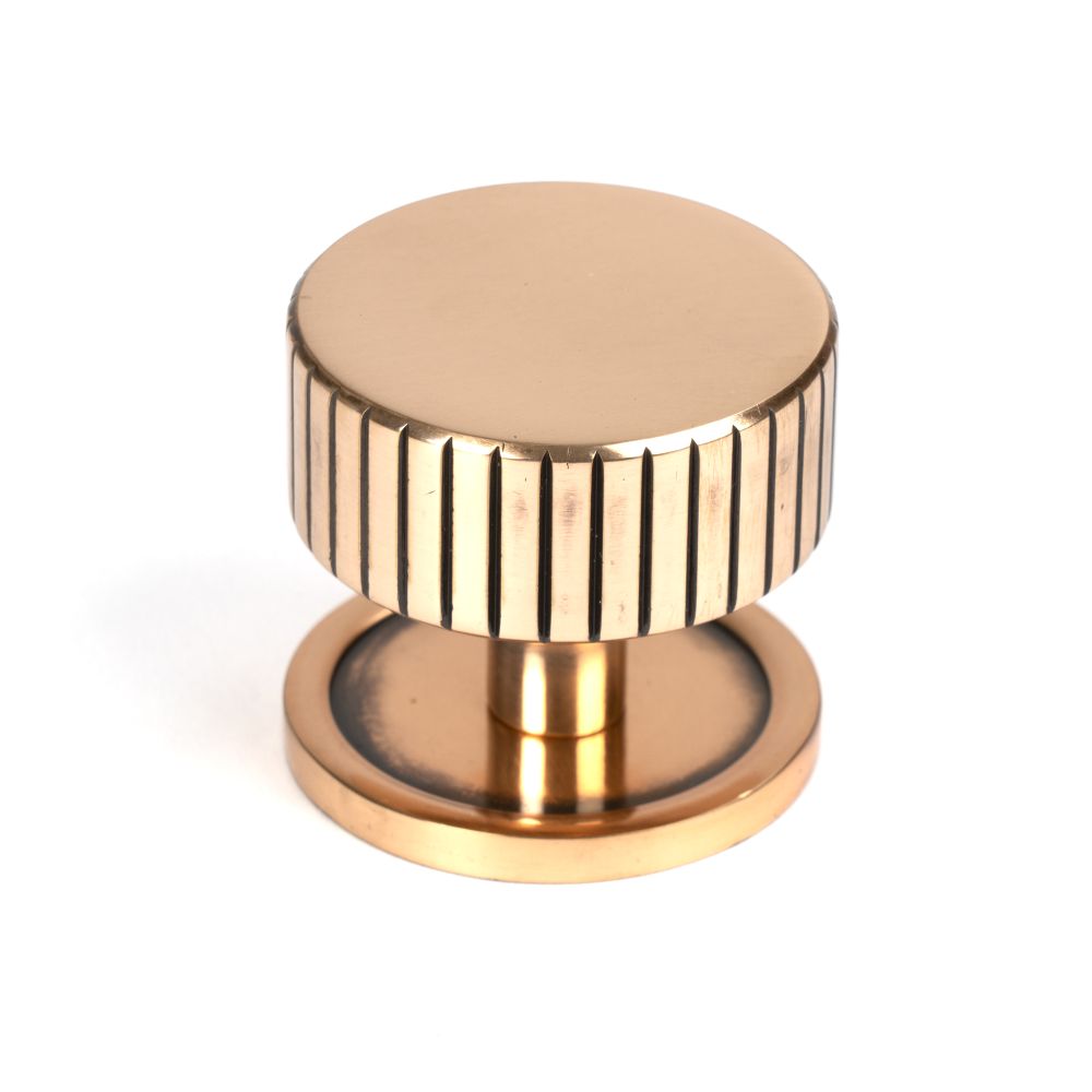This is an image showing From The Anvil - Polished Bronze Judd Cabinet Knob - 38mm (Plain) available from T.H Wiggans Architectural Ironmongery in Kendal, quick delivery and discounted prices