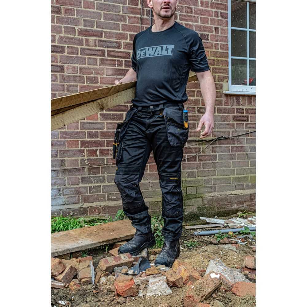 This is an image of DeWalt - Regular Fit Stretch Trouser Harrison L30W42 available to order from T.H Wiggans Architectural Ironmongery in Kendal, quick delivery and discounted prices.