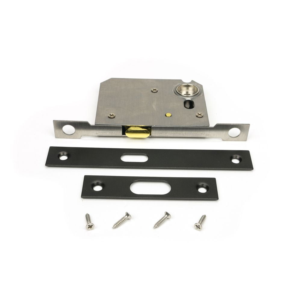 This is an image showing From The Anvil - Aged Bronze 50mm Sliding Door Lock available from T.H Wiggans Architectural Ironmongery in Kendal, quick delivery and discounted prices