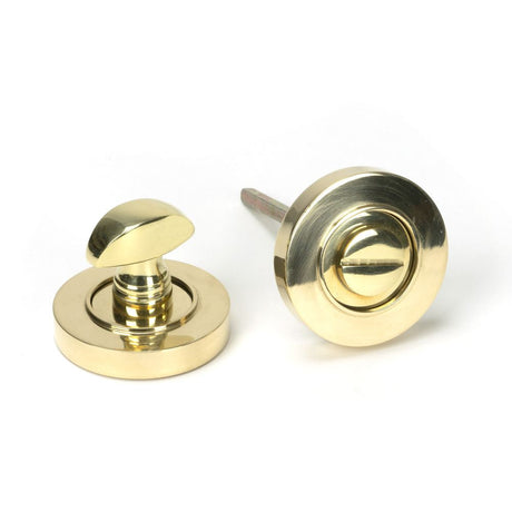 This is an image of From The Anvil - Polished Brass Round Thumbturn Set (Plain) available to order from T.H Wiggans Architectural Ironmongery in Kendal, quick delivery and discounted prices.