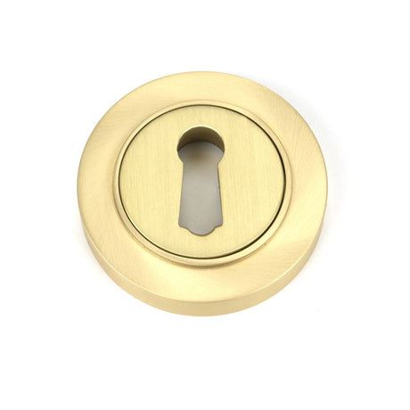 This is an image of From The Anvil - Satin Brass Round Escutcheon (Plain) available to order from T.H Wiggans Architectural Ironmongery in Kendal, quick delivery and discounted prices.