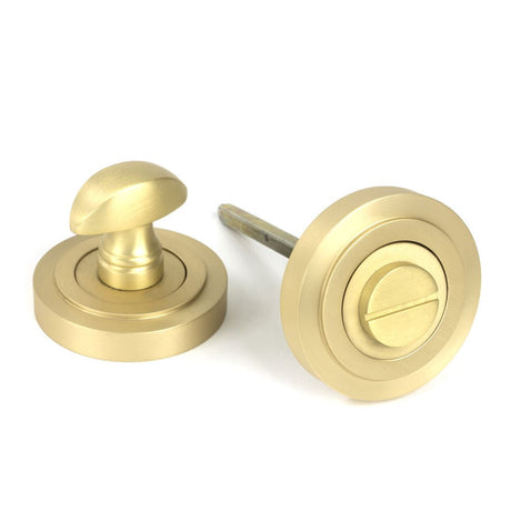 This is an image of From The Anvil - Satin Brass Round Thumbturn Set (Art Deco) available to order from T.H Wiggans Architectural Ironmongery in Kendal, quick delivery and discounted prices.
