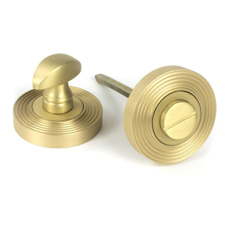 This is an image of From The Anvil - Satin Brass Round Thumbturn Set (Beehive) available to order from T.H Wiggans Architectural Ironmongery in Kendal, quick delivery and discounted prices.