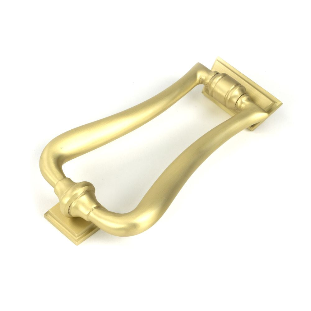 This is an image showing From The Anvil - Satin Brass Slimline Art Deco Door Knocker available from trade door handles, quick delivery and discounted prices