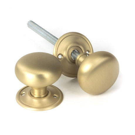 This is an image of From The Anvil - Satin Brass Mushroom Mortice/Rim Knob Set available to order from T.H Wiggans Architectural Ironmongery in Kendal, quick delivery and discounted prices.
