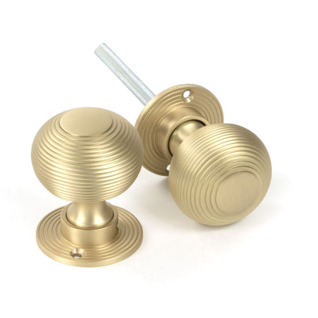 This is an image of From The Anvil - Satin Brass Heavy Beehive Mortice/Rim Knob Set available to order from T.H Wiggans Architectural Ironmongery in Kendal, quick delivery and discounted prices.