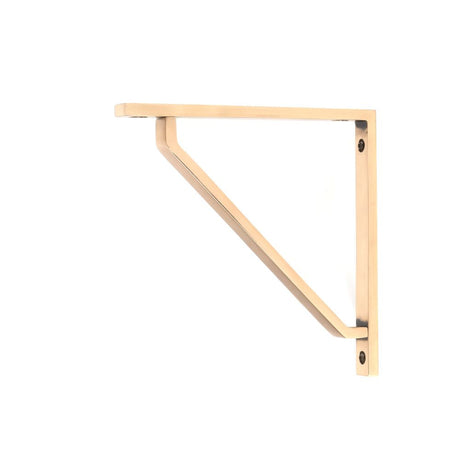 This is an image showing From The Anvil - Polished Bronze Barton Shelf Bracket (150mm x 150mm) available from T.H Wiggans Architectural Ironmongery in Kendal, quick delivery and discounted prices