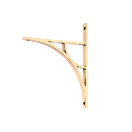 This is an image showing From The Anvil - Polished Bronze Tyne Shelf Bracket (260mm x 200mm) available from T.H Wiggans Architectural Ironmongery in Kendal, quick delivery and discounted prices