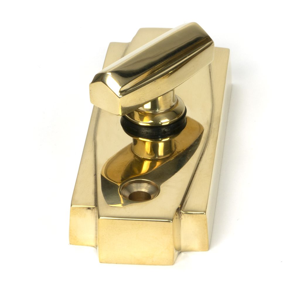 This is an image showing From The Anvil - Polished Brass Art Deco Thumbturn available from trade door handles, quick delivery and discounted prices