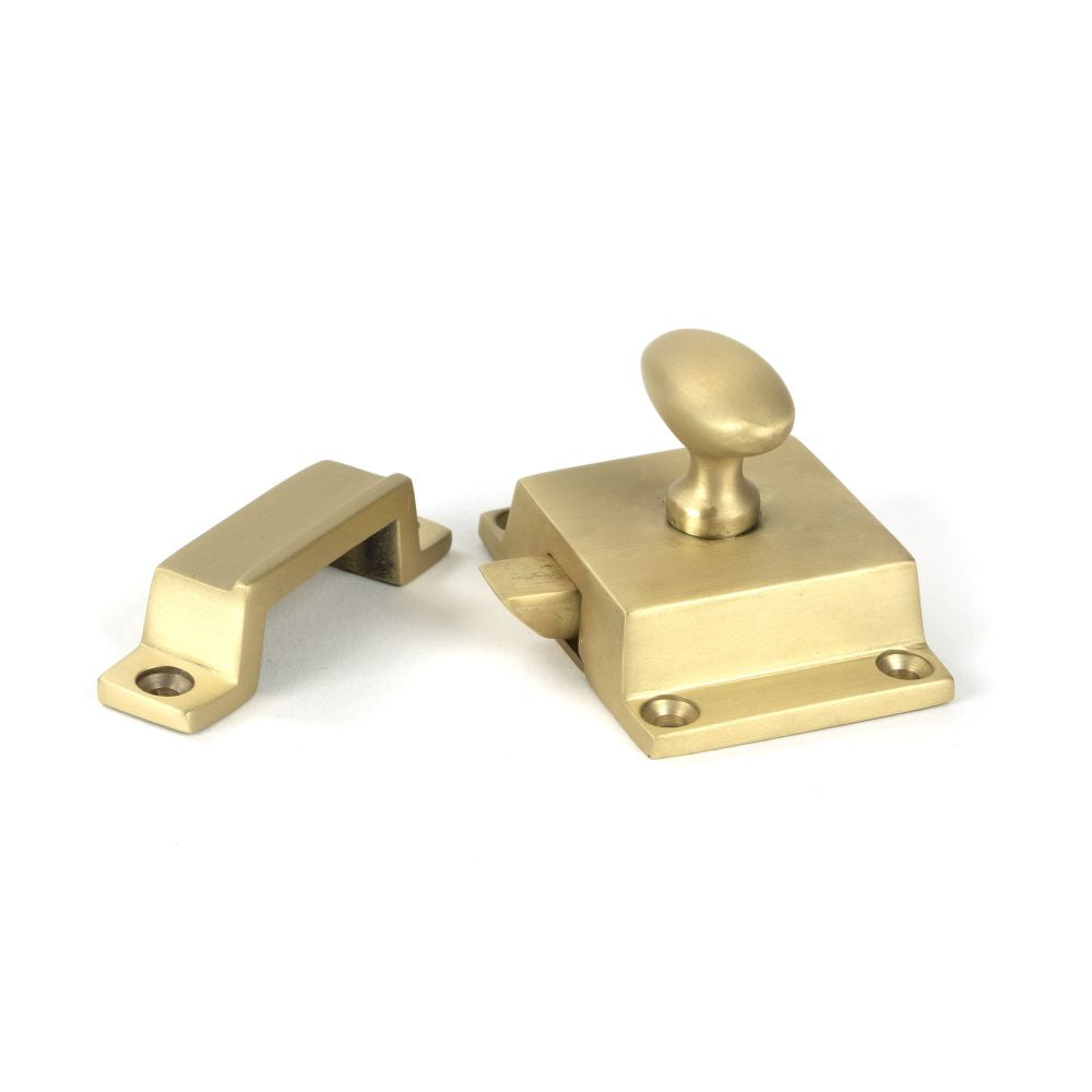 This is an image showing From The Anvil - Satin Brass Cabinet Latch available from trade door handles, quick delivery and discounted prices