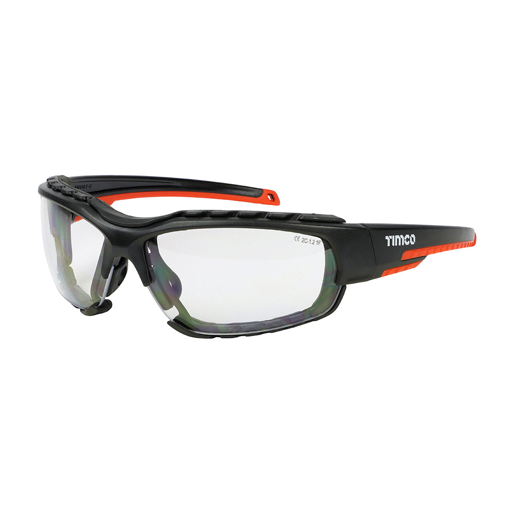 This is an image showing TIMCO Sports Style Safety Glasses - With Foam Dust Guard - Clear - One Size - 1 Each Box available from T.H Wiggans Ironmongery in Kendal, quick delivery at discounted prices.
