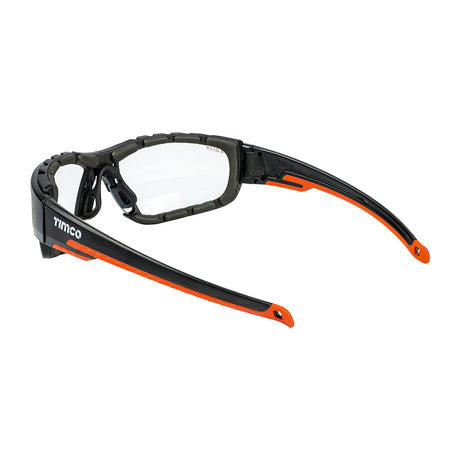 This is an image showing TIMCO Sports Style Safety Glasses - With Foam Dust Guard - Clear - One Size - 1 Each Box available from T.H Wiggans Ironmongery in Kendal, quick delivery at discounted prices.