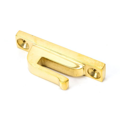 This is an image showing From The Anvil - Polished Brass Hook Plate available from T.H Wiggans Architectural Ironmongery in Kendal, quick delivery and discounted prices