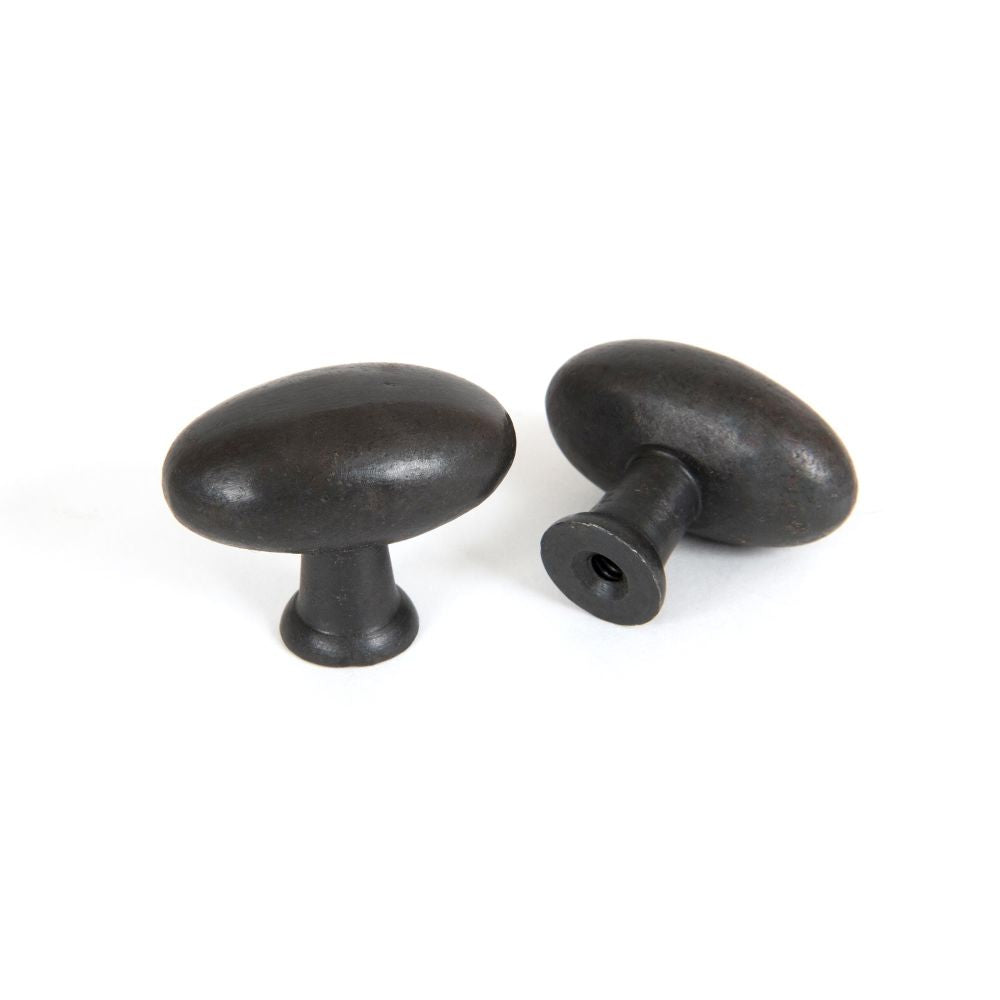 This is an image showing From The Anvil - Beeswax Oval Cabinet Knob available from T.H Wiggans Architectural Ironmongery in Kendal, quick delivery and discounted prices